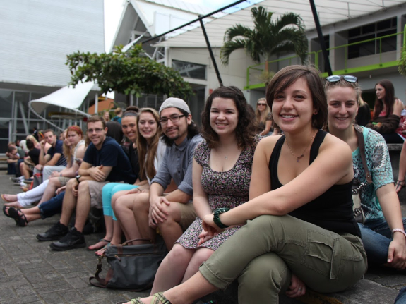 A group of students sitting and smiling in Costa Rica